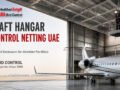 Aircraft Hangar Bird Control Netting UAE showing professional technicians installing overhead bird netting above an aircraft inside a modern aviation hangar.